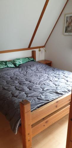 a bedroom with a bed in a room at Ferienhaus Nr. 60 Im Ferienpark am Twistesee in Bad Arolsen
