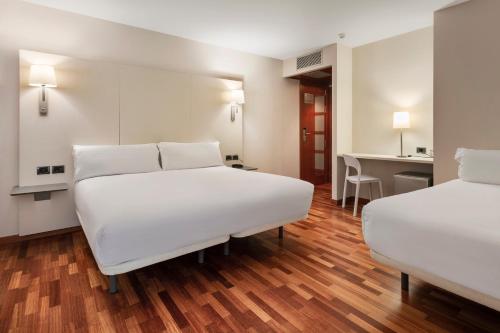 Krevet ili kreveti u jedinici u objektu B&B HOTEL Castellón