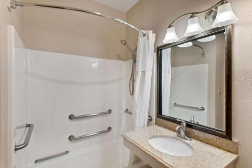 a bathroom with a sink and a shower at Quality Inn in Cedar Park