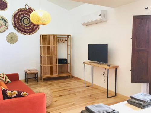 TV a/nebo společenská místnost v ubytování Llar de Beniardà