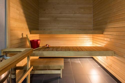 a small room with a wooden floor and wooden walls at Viiking Spa Hotel in Pärnu