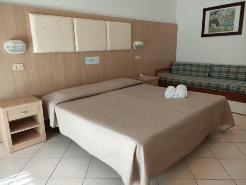 Postel nebo postele na pokoji v ubytování Hotel Cormoran