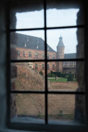 a view of a building through a window at Kasteel Huis Bergh in 's-Heerenberg