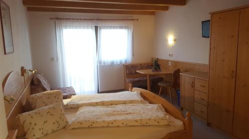 Ένα ή περισσότερα κρεβάτια σε δωμάτιο στο Gasthof Walde