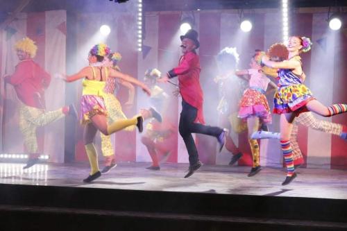 a group of people dancing on a stage at SevServices aux Dunes de Contis in Saint-Julien-en-Born