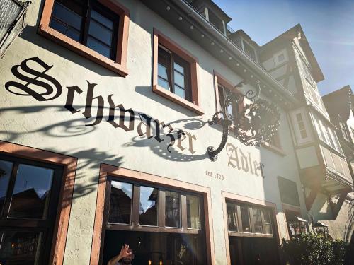 a sign on the side of a building at Schwarzer Adler in Michelstadt