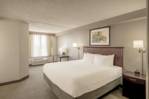 a large white bed in a hotel room at Hyatt Place College Station in College Station