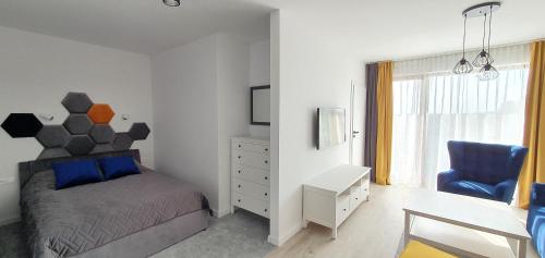 Vuode tai vuoteita majoituspaikassa Apartamenty CAMI BLU Sarbinowo