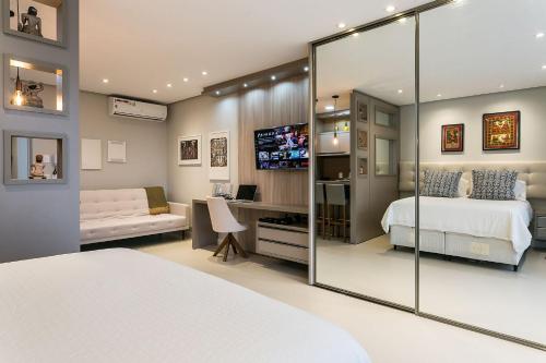 a bedroom with a bed and a sliding glass door at WI-FI 350MB | Food Hall | 450m do Shopping #CA04 in Florianópolis