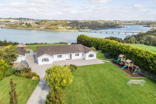 an aerial view of a house with a view of the water at Marina views, Kinsale, Hosted by Exquisite holiday homes, sleeps 20 in Kinsale