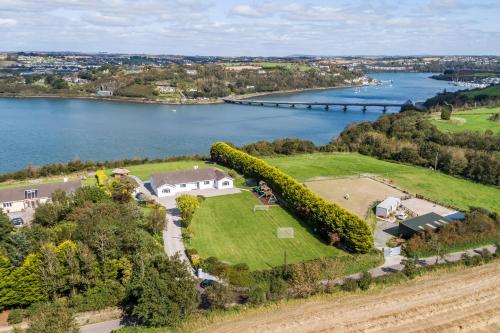 an aerial view of a large estate next to a body of water at Marina views, Kinsale, Hosted by Exquisite holiday homes, sleeps 20 in Kinsale