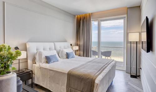 Postel nebo postele na pokoji v ubytování Hotel Abner's