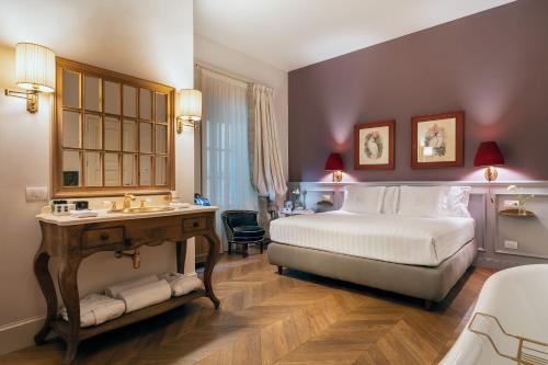 Voodi või voodid majutusasutuse Corte Calzaiuoli Elegant Suites toas