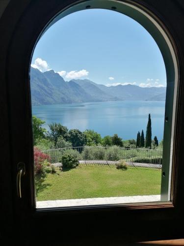a view of a lake from a window at Villa Daniela in Riva di Solto