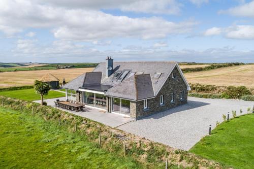 an aerial view of a house in a field at Ocean View,Kinsale, Hosted by Exquisite holiday homes, sleeps 22 in Kinsale