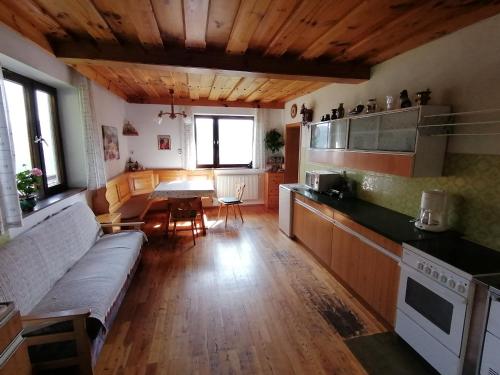 a living room with a couch and a table in it at Ferienhaus Stubalpenblick in Salla