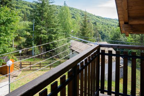 a balcony of a cabin with a view of a mountain at Mansarda Villa Adele in Santo Stefano dʼAveto