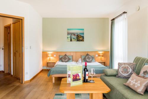 a hotel room with a bed and a couch at Ökotel Hamburg in Hamburg