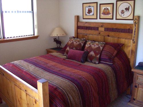 a bedroom with a large bed and a window at Breckenridge Mtn Village 132 - Beautiful Private Home just blocks from Main Street in Breckenridge