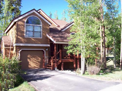 a brown house with a garage on a driveway at Breckenridge Mtn Village 132 - Beautiful Private Home just blocks from Main Street in Breckenridge