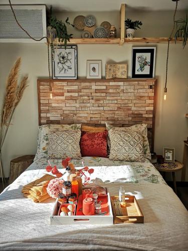 a tray of food on top of a bed at OH ! MADIANA in Saint-Jean-dʼIllac