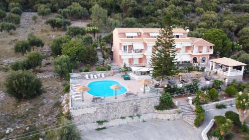 an aerial view of a house with a swimming pool at Stefanosplace ApartHotel Sea View in Barbati
