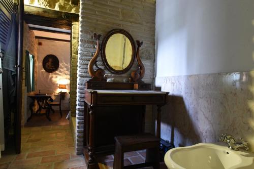 a bathroom with a sink and a mirror at Azzurro di Vallepietra in Camporotondo di Fiastrone