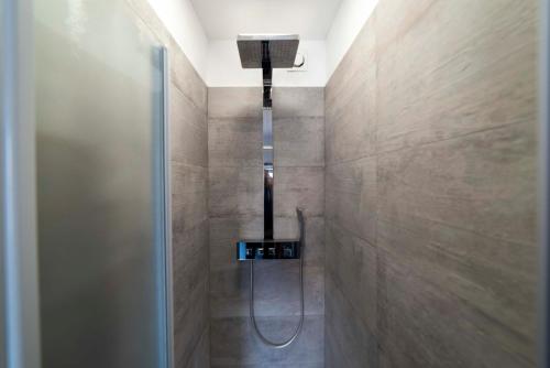 a shower with a shower head in a bathroom at Porto Antico in Bari
