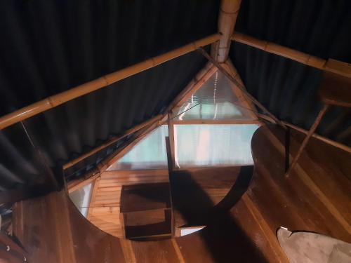 an overhead view of a wooden ceiling with a glass window at Kasaguadua - RESERVA NATURAL in Salento