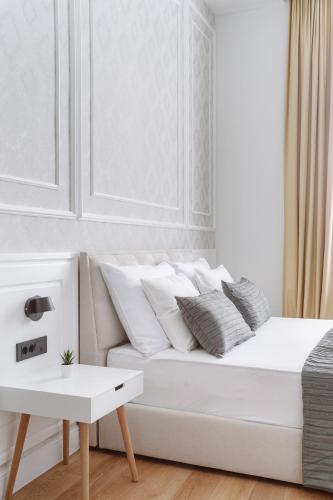 Letto o letti in una camera di THE City Lodge - Boutique Apartments