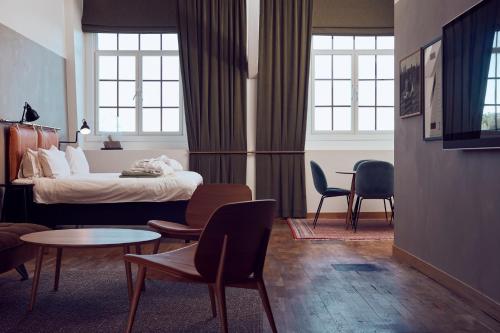 Postel nebo postele na pokoji v ubytování Nääs Fabriker Hotell & Restaurang
