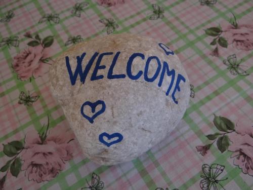 a rock with the word welcome written on it at Apartments and Rooms With View on Bled in Bled