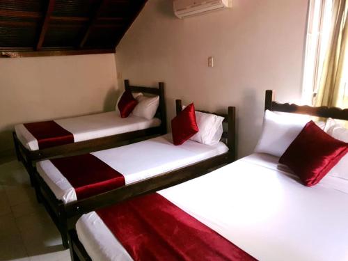 Postel nebo postele na pokoji v ubytování Hotel Don Juan Colonial