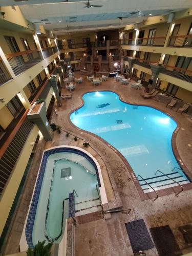 an overhead view of a large swimming pool in a hotel at Baymont by Wyndham Shakopee in Shakopee