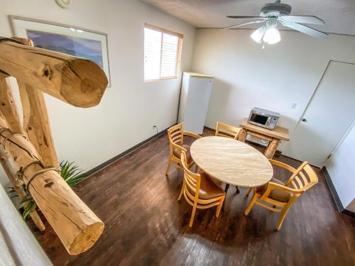 a dining room with a table and chairs at Fort Verde Suites in Camp Verde