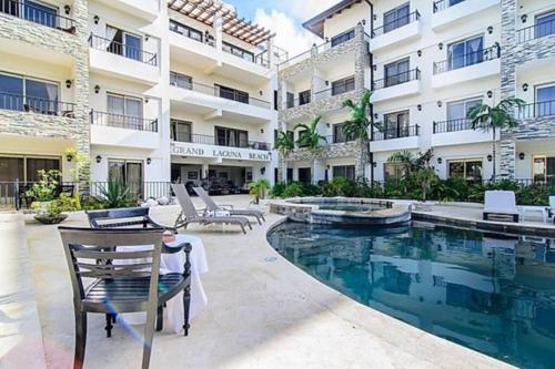 a swimming pool in front of a building at Best ocean view Sosua-Cabarete in Sosúa