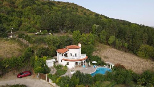 an aerial view of a house with a swimming pool at Villa Sky Music in Obzor