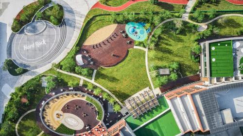 an overhead view of a park with a building at Hard Rock Hotel Dalian in Dalian