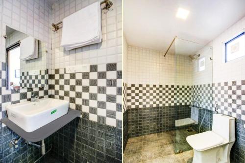 een badkamer met een wastafel en een toilet bij Sea Shell Beach Cottages & Suites in Arambol
