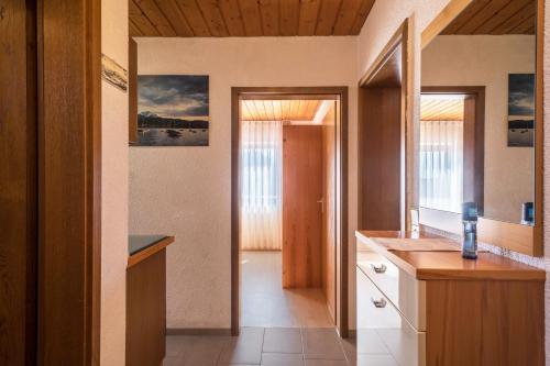 a kitchen with a sink and a counter top at Ferienwohnung Monika Haug in Immenstaad am Bodensee