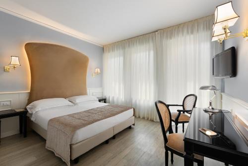 Letto o letti in una camera di Hotel San Luca