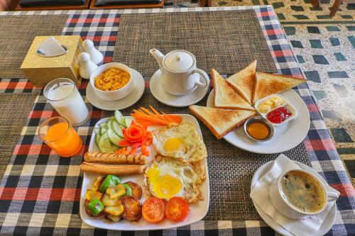 a plate of breakfast food on a table at Hotel Bougainvillea in Pokhara
