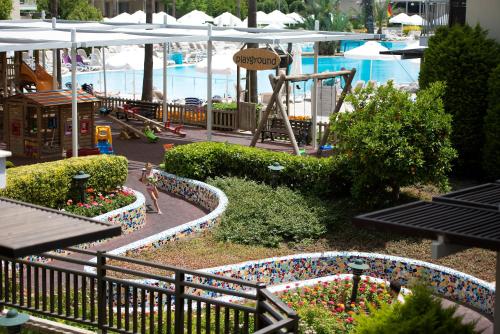 a miniature park with a playground and a play area at Barut B Suites in Side