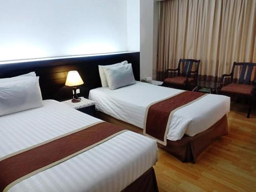 V Verve Service Apartment Hotelにあるベッド