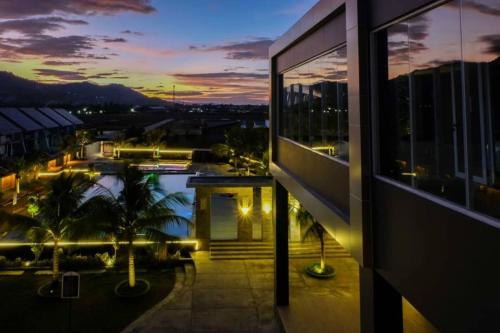 a view of a city at night from a building at Aston Gorontalo Hotel & Villas in Gorontalo