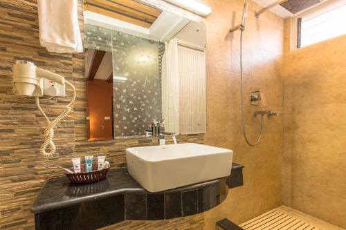 a bathroom with a sink and a shower at Hotel Moonlight in Kathmandu