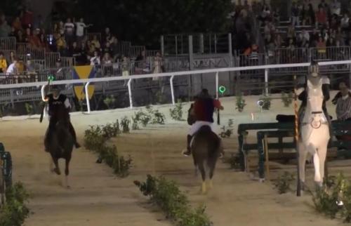 two people riding horses in a horse race at Villa Linda Bed And Breakfast in Sulmona