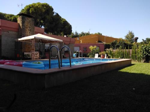 a large swimming pool with aitatingfficientfficientfficientfficientfficientfficient at Apartamento Laila,Sevilla, in Alcalá de Guadaira
