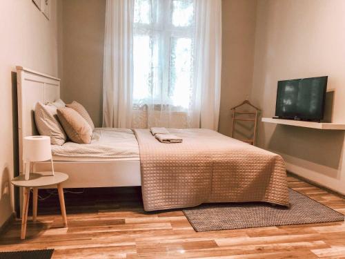En eller flere senger på et rom på Bankowa 8 Guest Rooms