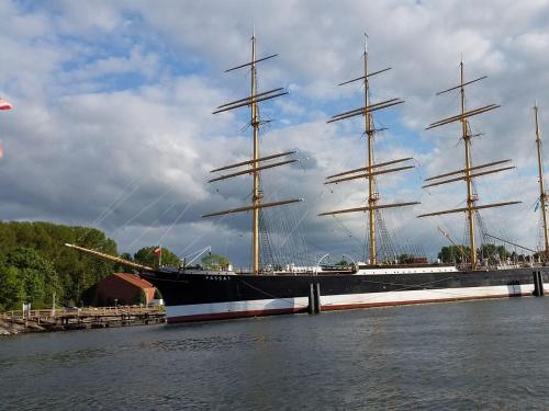 a large pirate ship sitting in the water at Schwalbennest in Lübeck